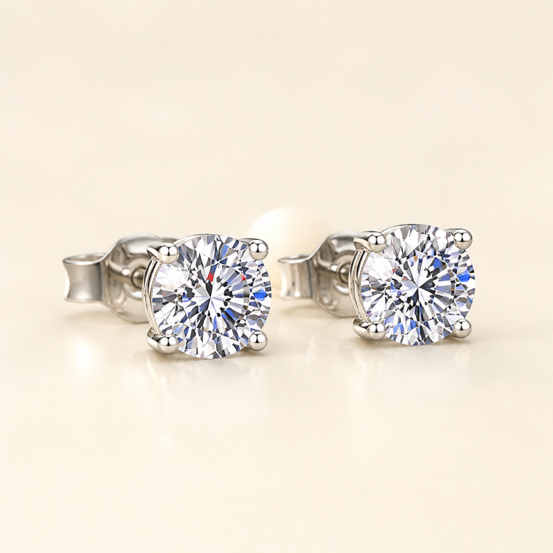 Three-quarter studio view of four-prong round moissanite stud earrings