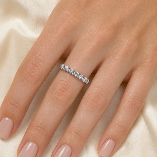 Gallery 2026 · Seven-stone moissanite band worn on hand