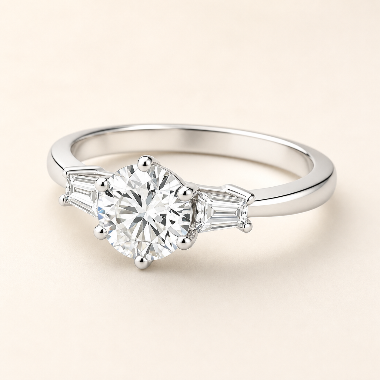 Three-quarter studio view of a six-prong moissanite ring with tapered baguette side stones