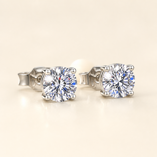 Three-quarter studio view of four-prong round moissanite stud earrings