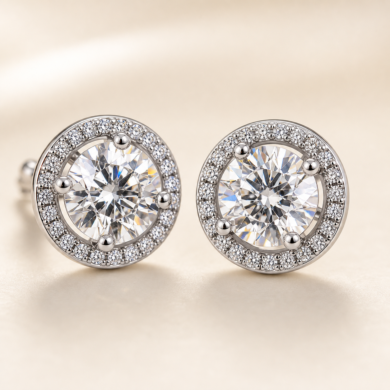 Studio detail of round halo moissanite stud earrings