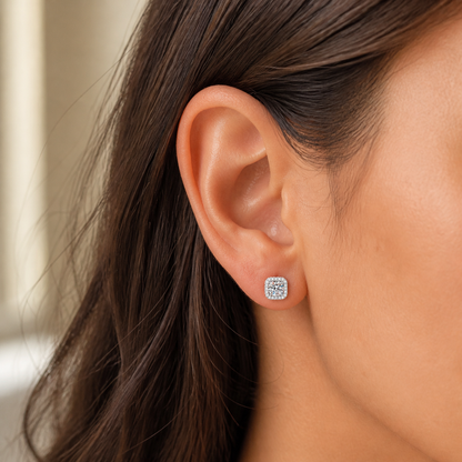 Square halo moissanite stud earring shown at a natural scale on the ear