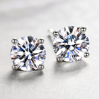Macro detail of the four-prong round moissanite stud settings