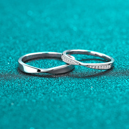 Coordinating polished and moissanite accent twist wedding bands in silver