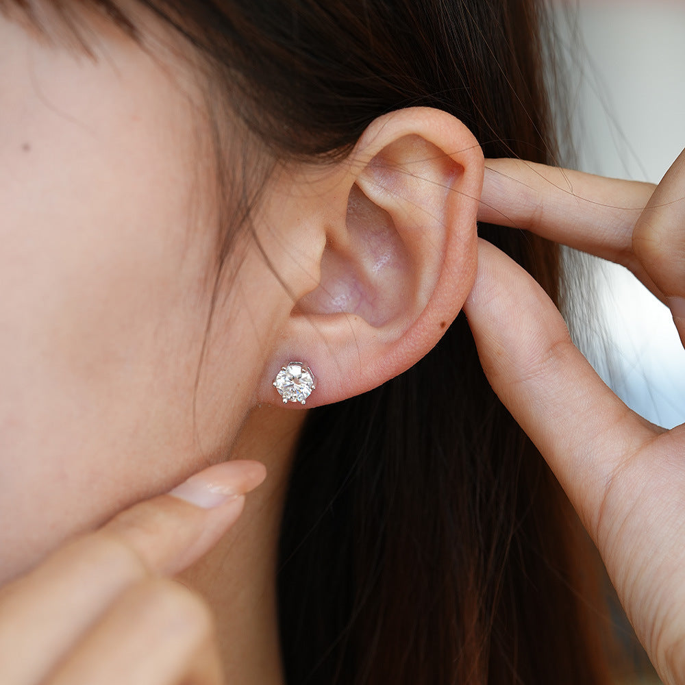 Side angle showing the six-prong basket of the moissanite studs