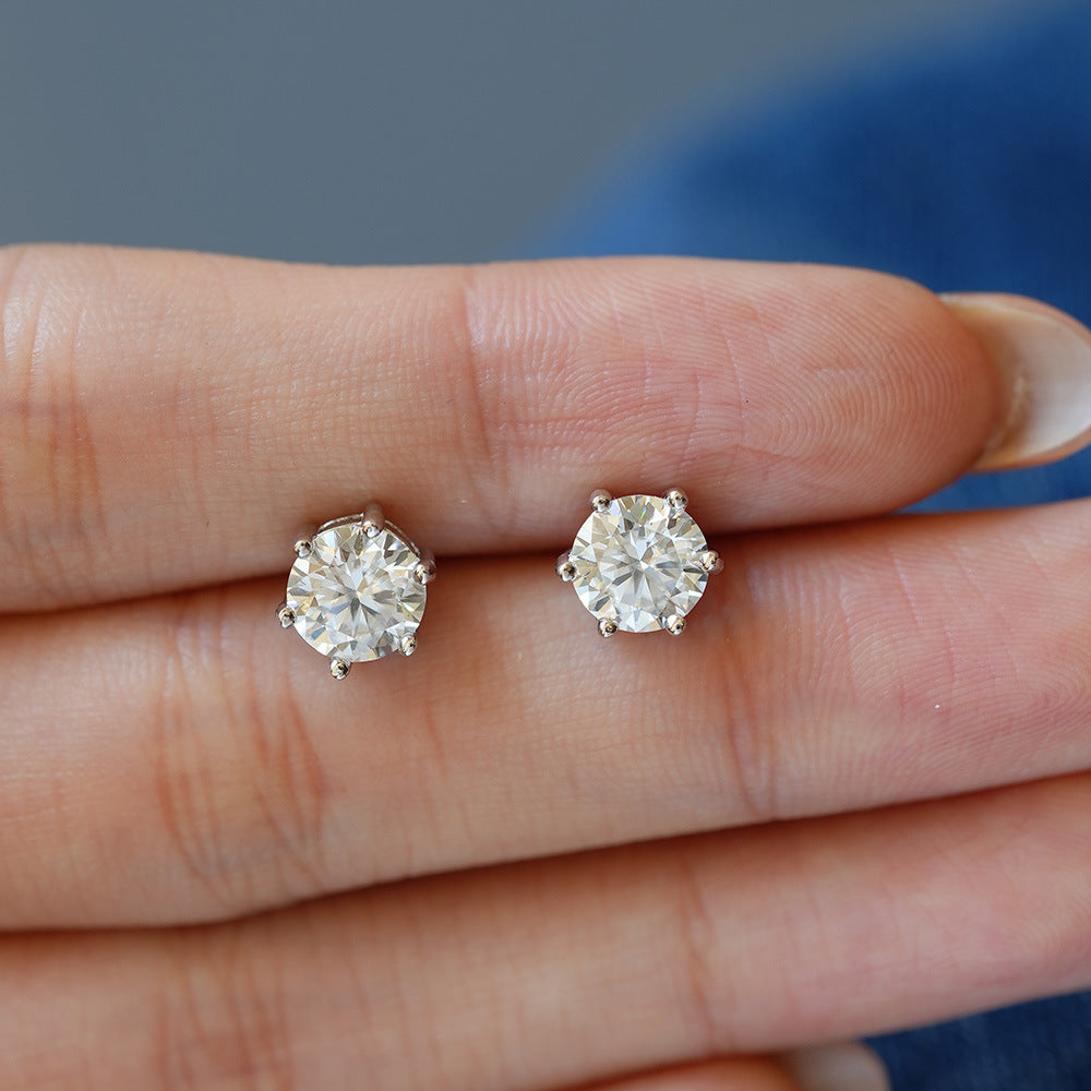 Close detail of the round-cut stones and six-prong silver settings