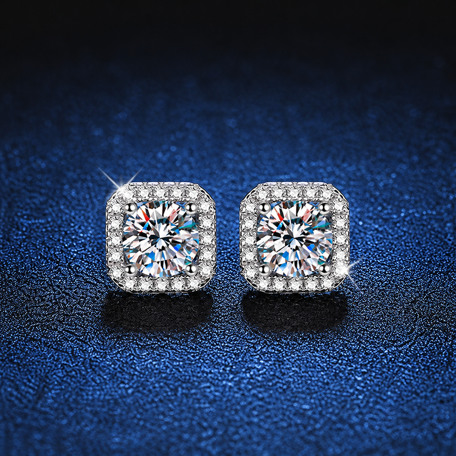 Pair of round moissanite stud earrings framed by square halo accents