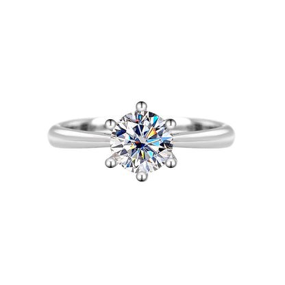 Front view of a round moissanite solitaire in a six-prong S925 silver setting