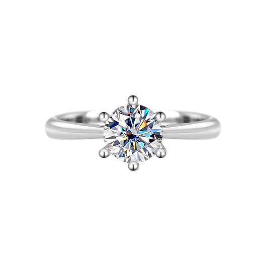 Front view of a round moissanite solitaire in a six-prong S925 silver setting