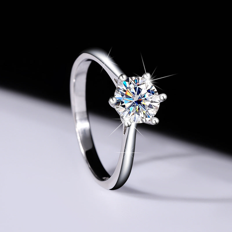 Angled side view of the six-prong round moissanite ring