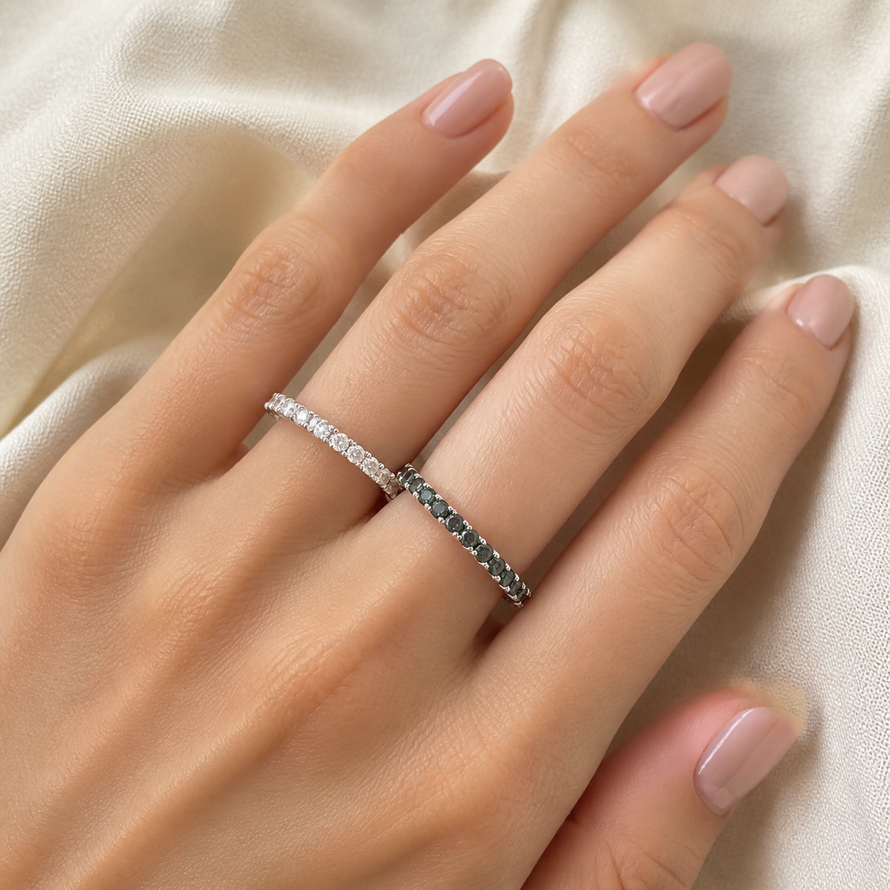Gallery 2026 · White and black eternity rings worn on hand